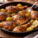 Garlic Butter Roast Chicken with Caramelized Onions and Potatoes