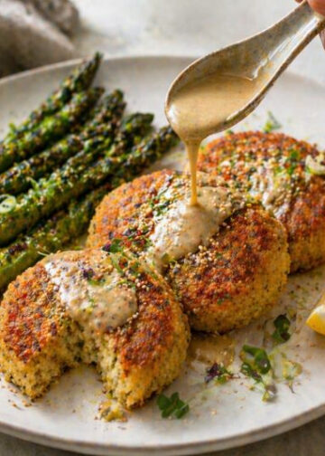 Herbed Millet Cakes with Lemon Tahini and Charred Asparagus