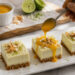 Toasted Coconut Lime Cheesecake Bars with Mango Coulis