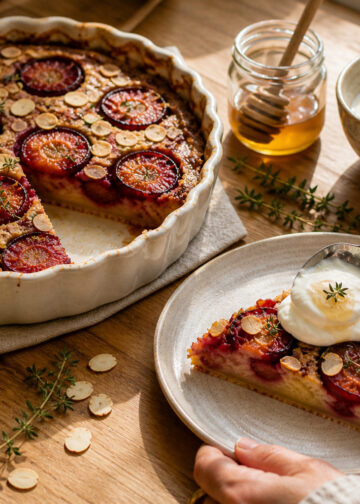 Roasted Plum Almond Clafoutis with Honeyed Yogurt