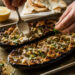 Charred Garlic-Tahini Roasted Eggplant with Toasted Pine Nuts